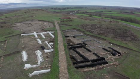 A bird&#039;s eye view of ancient ruins in an empty field in Bulgaria
