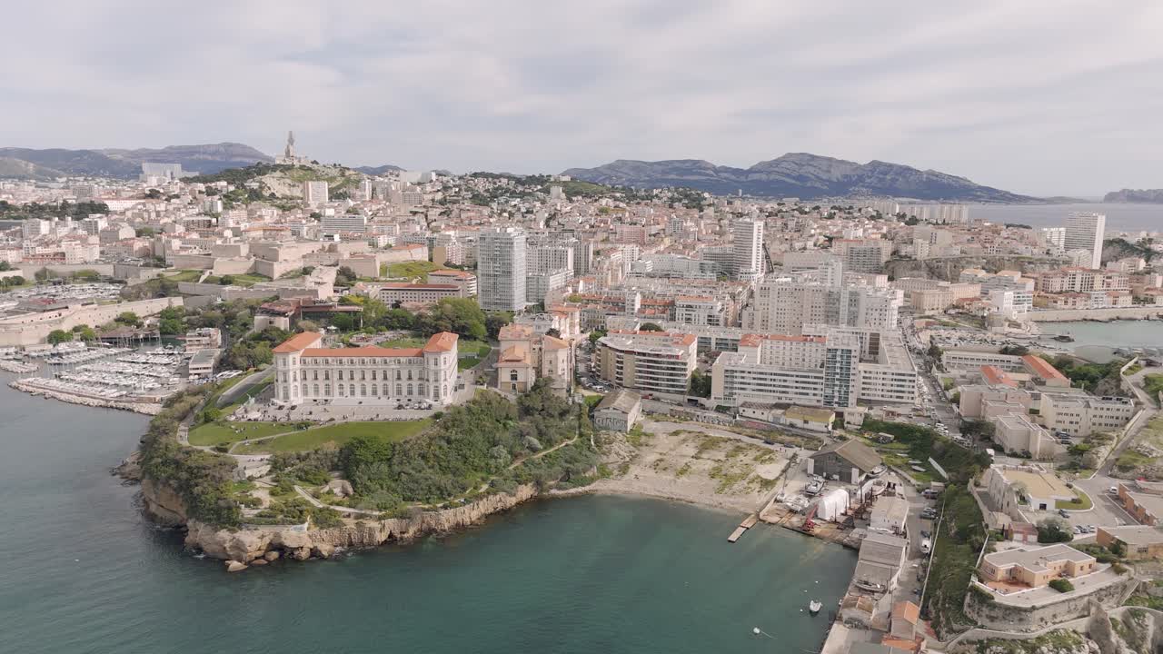 Aerial view of Palais du Pharo, Notre-Dame de la Garde in background, Marseille France