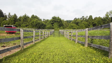 Two-pastures-with-wooden-fences-on-a-countryside-farm