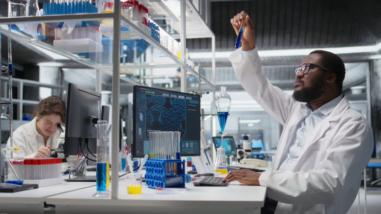 Vertical video Research facility expert typing on PC keyboard using chemical solutions