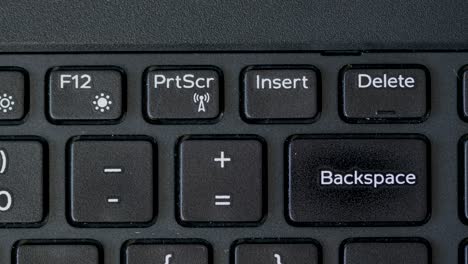 Top-View-Finger-Pressing-Delete-Keyboard-Button