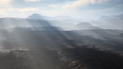 Paisaje-Desértico-Volcánico-Aéreo-Con-Rayos-De-Luz