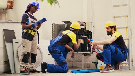 mechanics cleaning condenser compressor