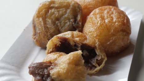 crispy fried dough balls with chocolate filling