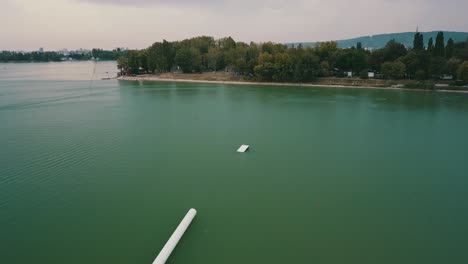 drone shot of the lake zlate piesky, bratislava, slovakia on a cloudy day
