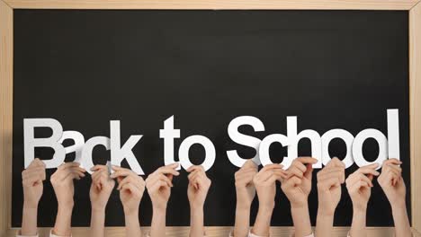 Hands-holding-up-back-to-school