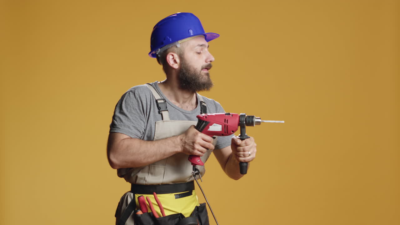 Repairman contractor drilling nails with electric power drill