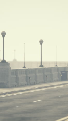 a view of a bridge on a foggy day