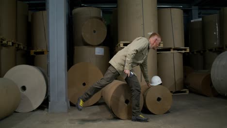 worker in a paper warehouse