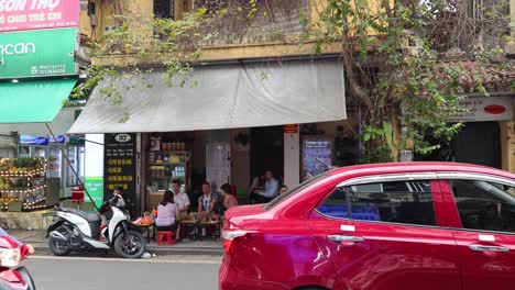 traffic and pedestrians on a bustling city road