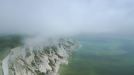 Seven-Systers-white-cliffs,-foggy-sky-and-sea-taken-by-dji-mini-3-pro-drone-in-Eastbourne-England