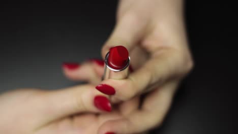 seductive red lipstick rolling out slowly closeup