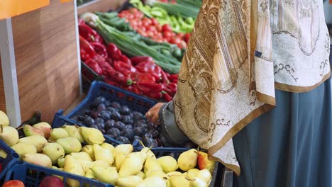 woman shopping for fruits and vegetables at grocery store