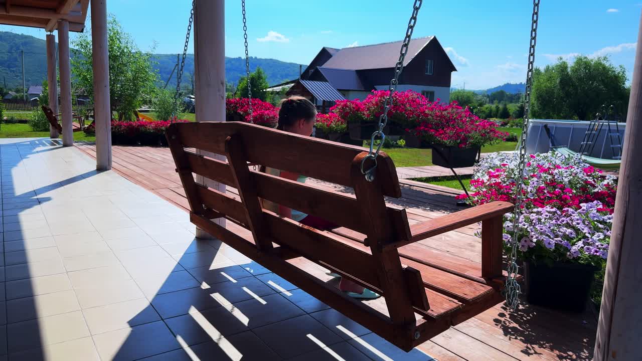 A Serene Swing in a Vibrant Garden: Embracing Nature's Beauty and Tranquility Amidst Colorful Blooms and a Peaceful Atmosphere