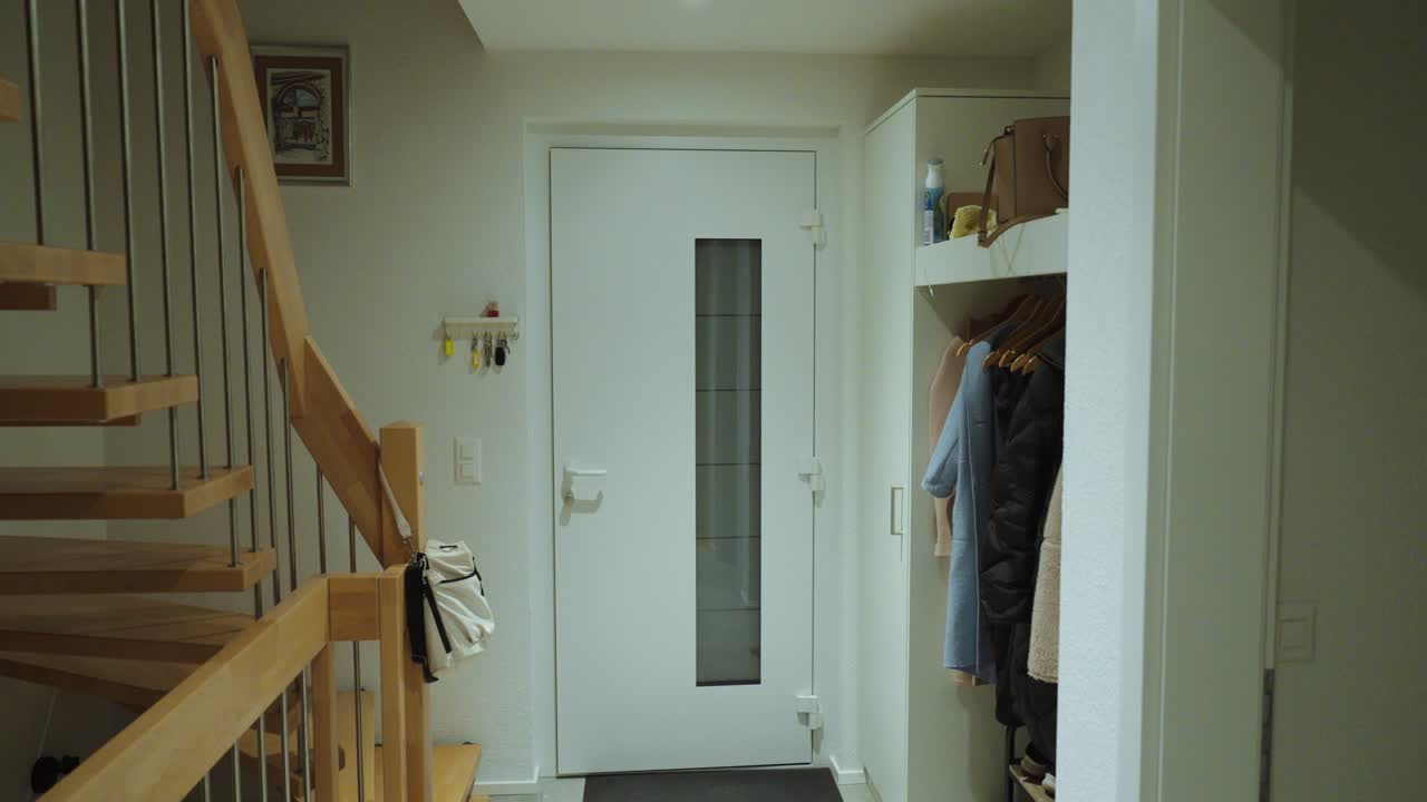 A worker wearing a reflective safety vest leaves the house and comes back. Concept of daily routine, work safety, and responsibility