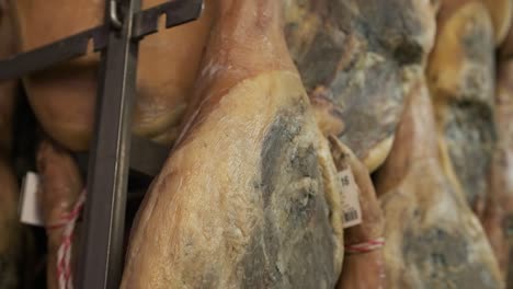 jamon serrano pig legs factory hanging in a industry. iberian ham elaboration process