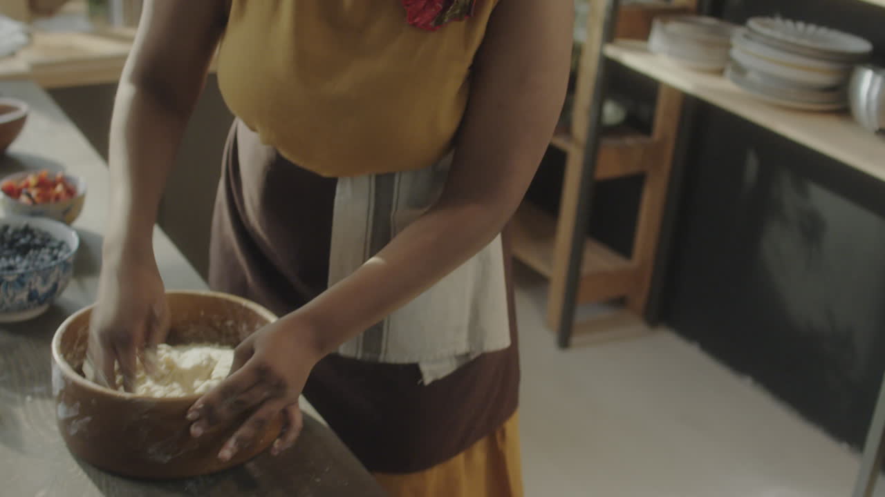 Female Culinary Blogger Kneading Dough and Talking on Camera