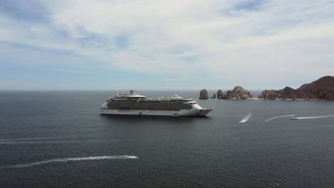 drone shot large cruise ship sailing in ocean for tourists travelling