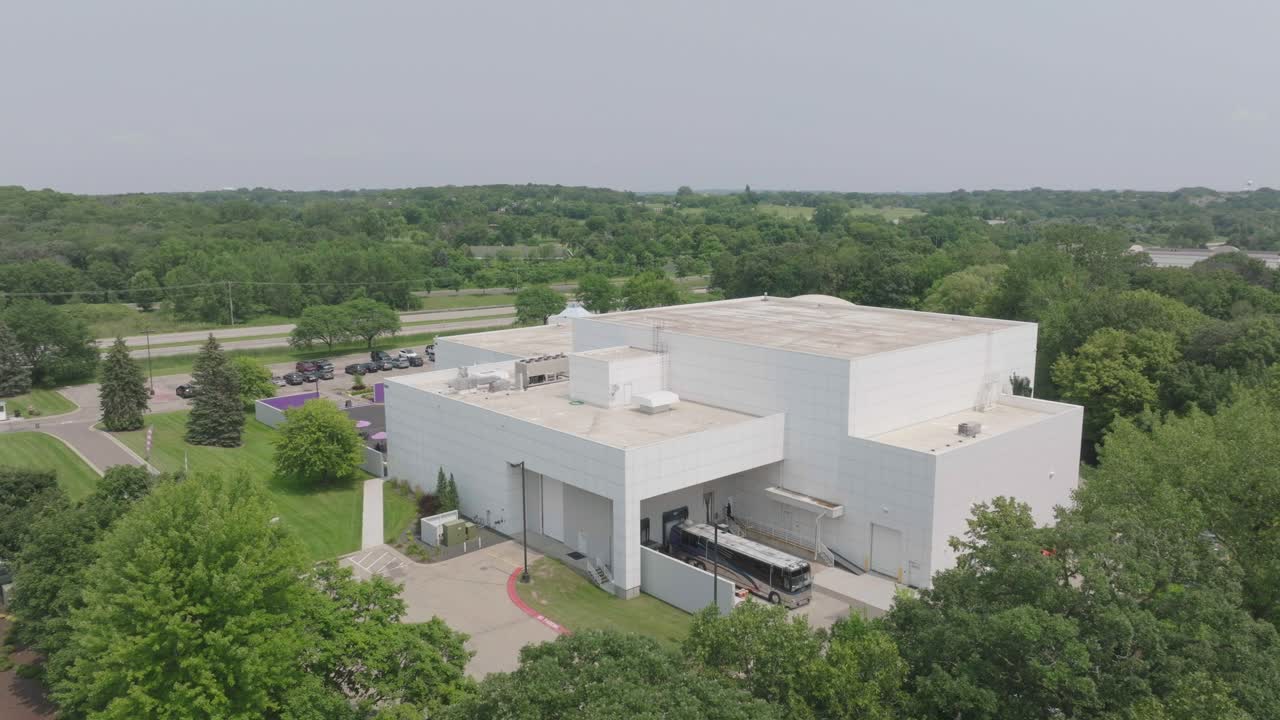 Aerial pan shot of Paisley Park, Princes house in Chaska Minnesota, USA during afternoon.