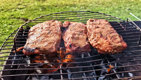 prime rib barbeque cooking outdoor over open fire charcoal bbq meat food dish