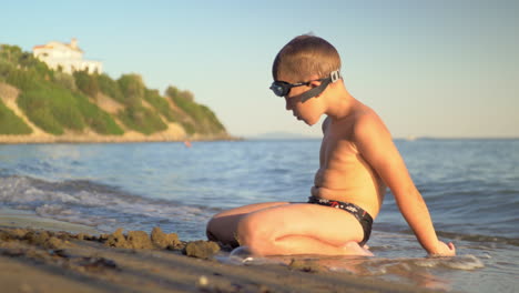 child enjoying summer holidays and relaxing at the seaside