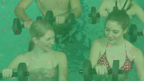 animation of confetti falling over happy caucasian women and man exercising with weights in pool