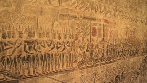 angkor wat temple corridor wall artwork in bas relief, cambodia