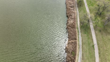 An-aerial-view-over-Flushing-Meadow-Corona-Park-in-Queens,-NY-on-a-sunny-day