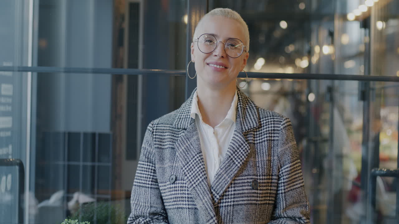 Woman using smartphone in modern office building