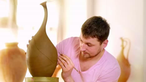a skilled artisan carefully shapes and embellishes an elegant clay vase, showcasing the art of pottery in a bright and inviting studio environment