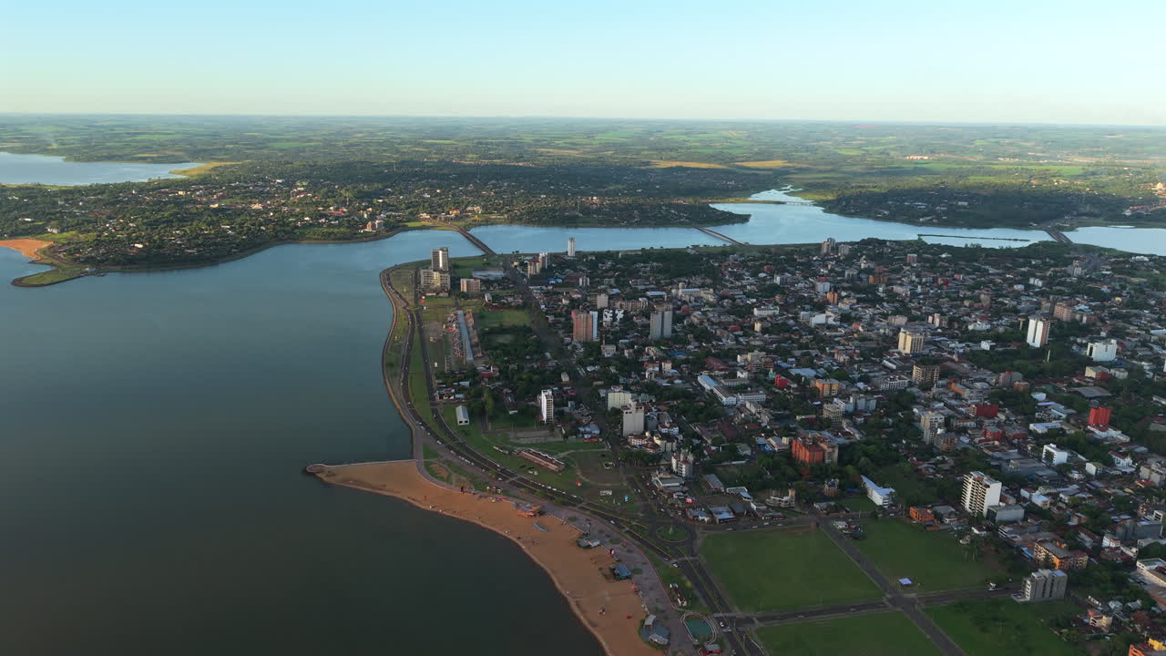 Aerial drone fly San Jose beach at Encarnación city Paraguay, drone landscape above Paraná river, border with Argentina