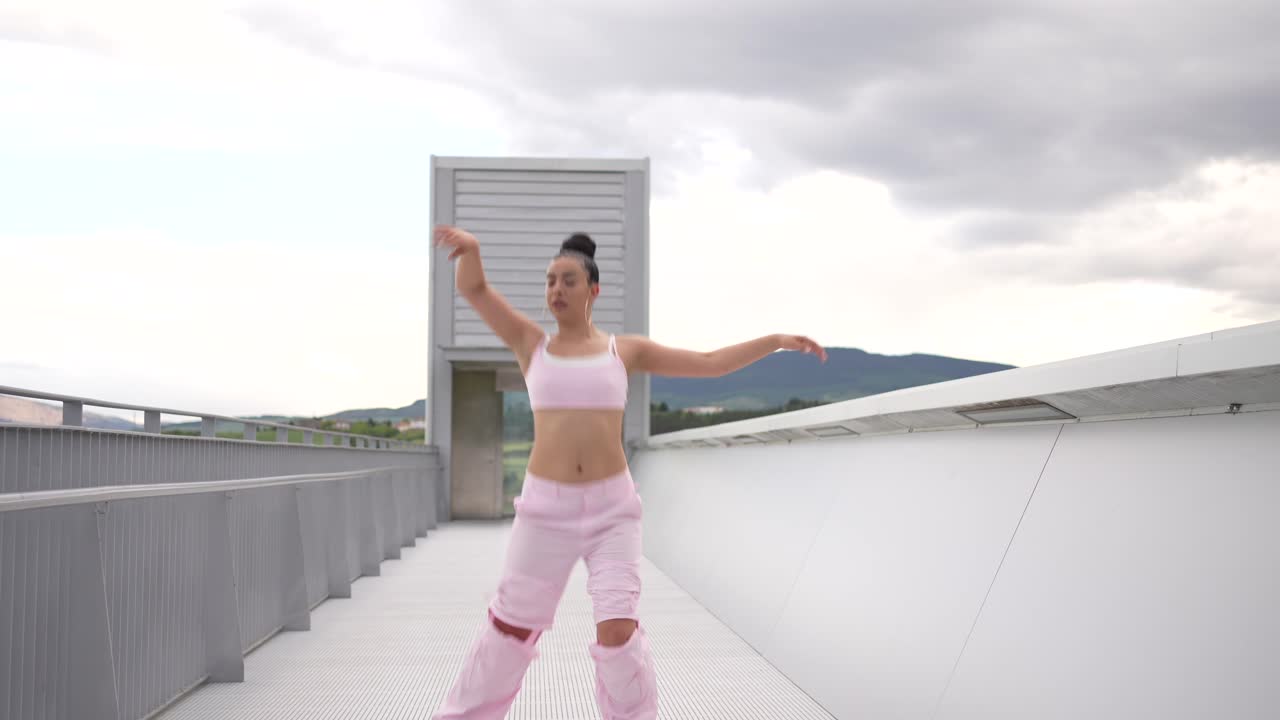 Woman Dancing on a Modern Bridge