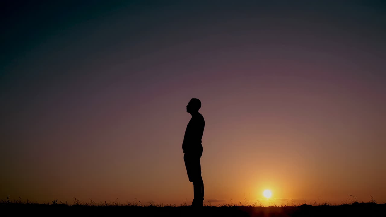 Man Standing at Sunset