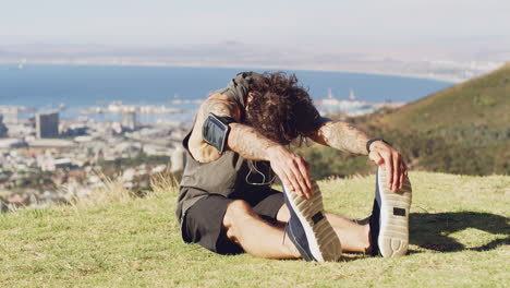 a young man stretching before a run outdoors