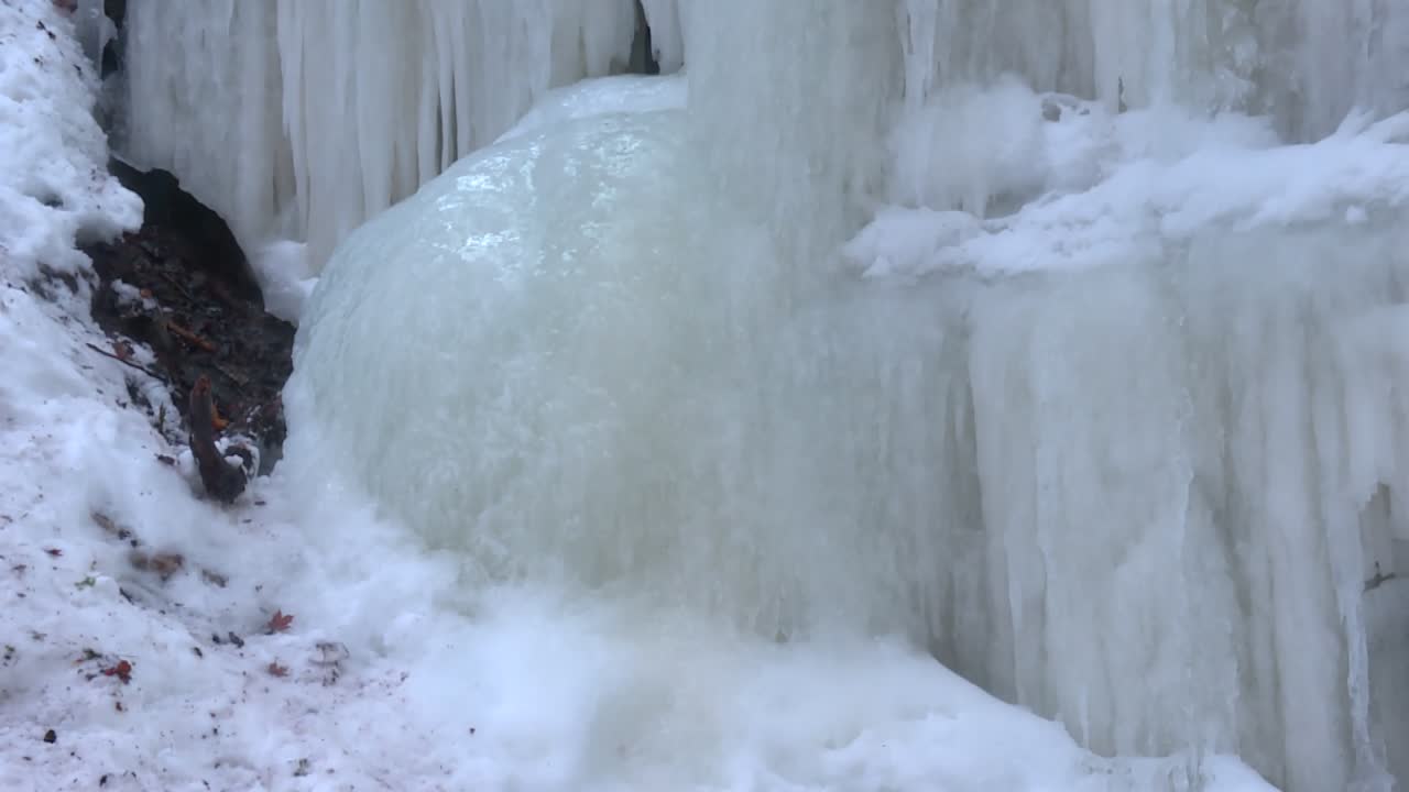 Thick Ice Formations Of Eben Ice Caves In Michigan, United States. Close-up Shot