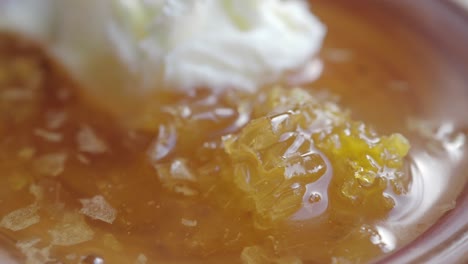 close up of a honey comb with honey