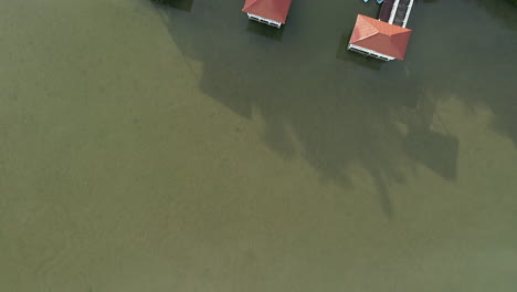 Dock-on-lake-of-north-park-Mirador-in-Santo-Domingo,-Aerial-top-down-forward