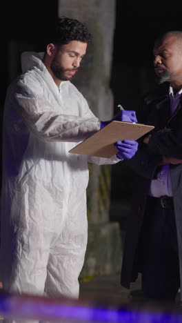 police officer and crime scene investigator at a crime scene