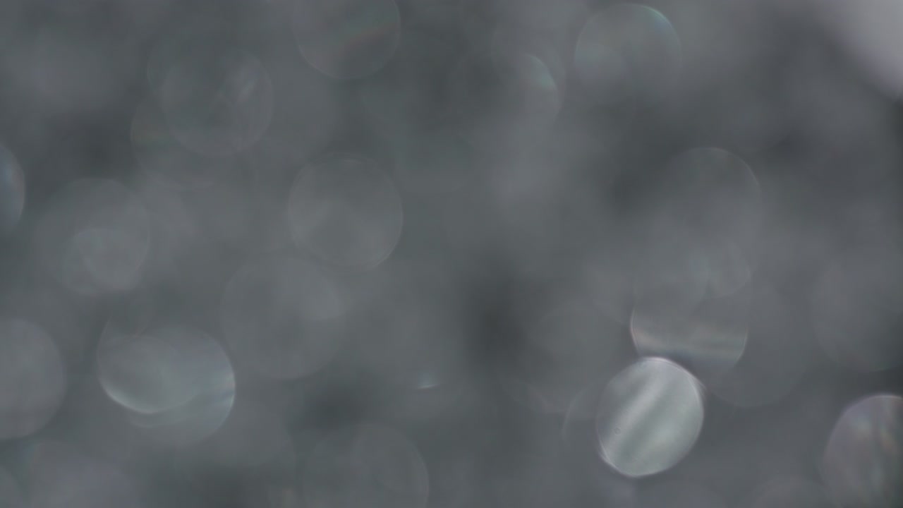 la rotación de los círculos bokeh en el sentido de las agujas del reloj