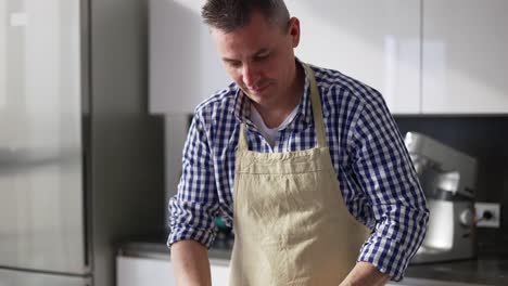 Man-Doing-Process-Mixing,-Making-Cake-On-A-Modern-Kitchen-At-Home