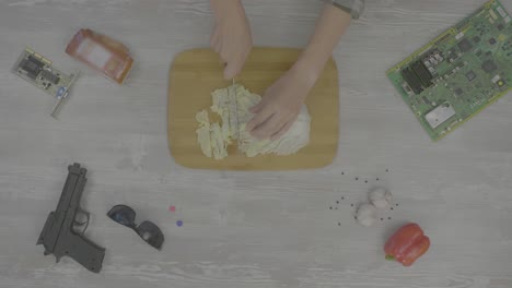 preparing a meal while surrounded by technology and accessories