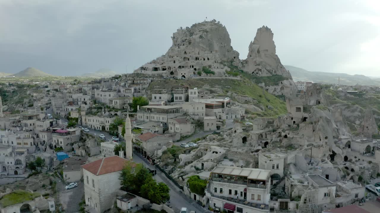 aerial drone view old Uchisar Castle in view of goreme village, Cappadocia