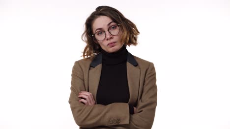 Portrait-of-and-attractive-brunette-woman-in-glasses-and-stylish-jacket-irritated-with-waiting,-yelling-and-gesturing-with