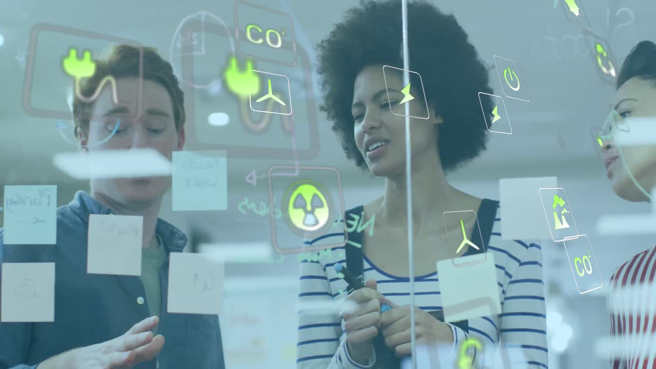 Animation of icons over diverse business people at office