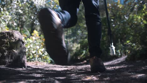 a man walking into the frame in slow motion during a hike in fuego volcano, guatemala