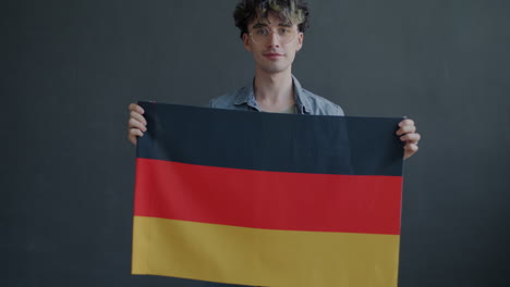 man holding the german flag