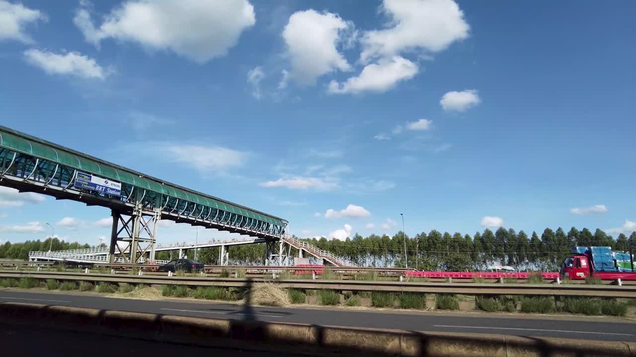 Highway Overpass with Cars and Trucks
