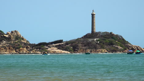 Gimbal-zoom-in-shot-of-Ke-ga-lighthouse-on-sunny-day,-Vietnam