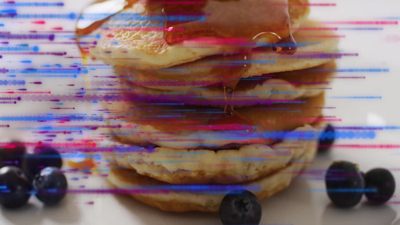 Pancakes topped with syrup and blueberries, glitch effect animation background