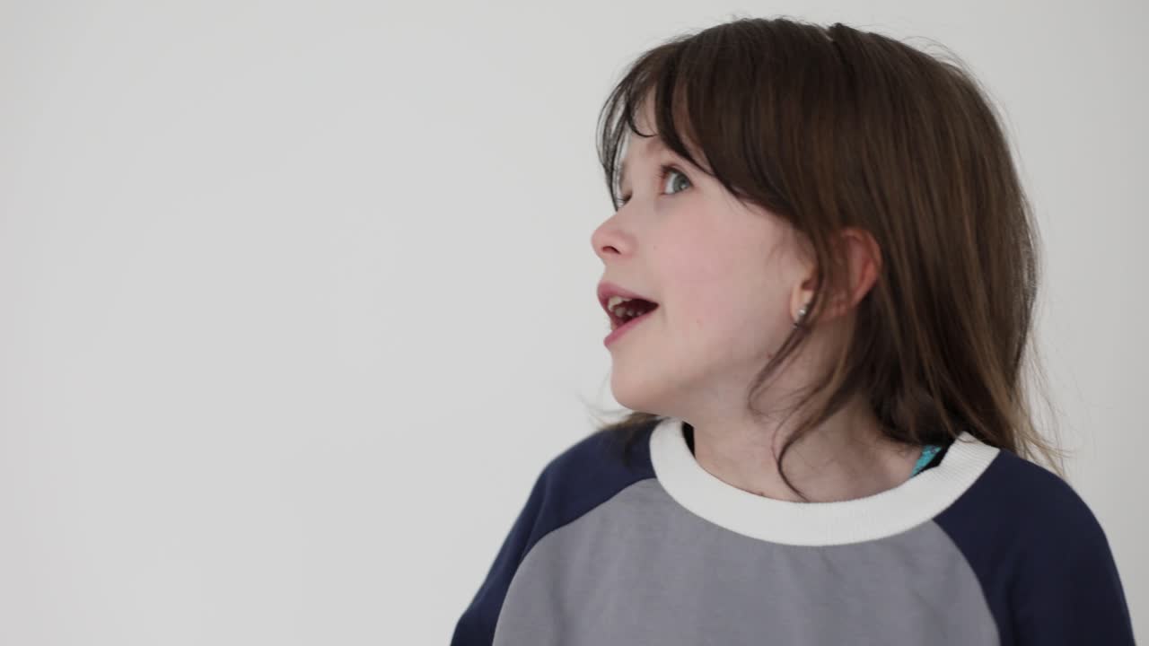 Surprised Child with Messy Face Looking Up